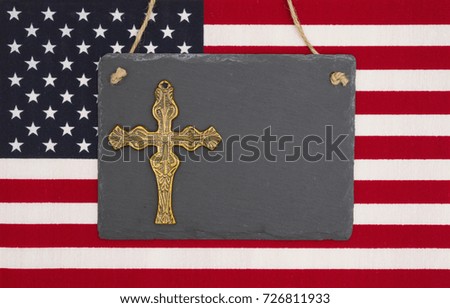 United States of America flag with a black chalkboard and cross with copy space for your message