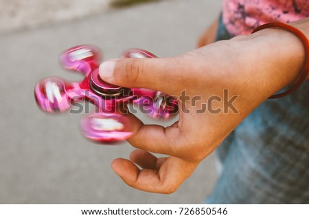 girl spinning a spinner in her hand