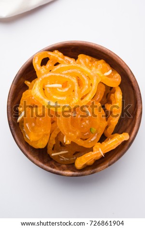 Stock photo of Jalebi or Jilbi or imarati, indian sweet food fried in pure ghee, selective focus Royalty-Free Stock Photo #726861904