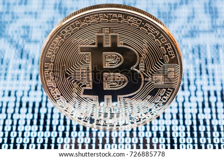 Bitcoin on white binary code background