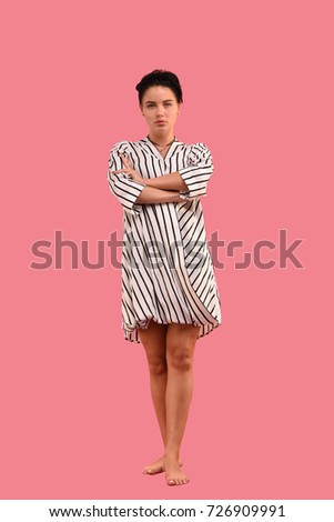 Charming brunette dressed in a striped dress