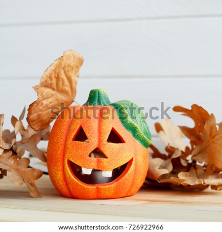 Picture of pumpkie over wooden background. Halloween concept.