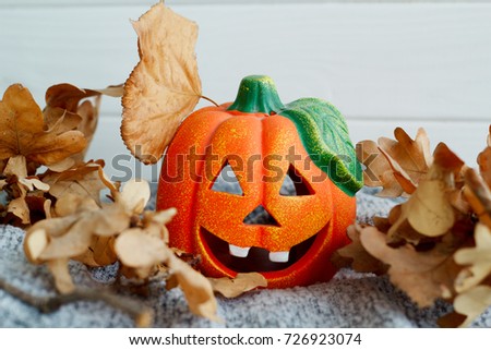 Picture of pumpkie over wooden background. Halloween funny concept.