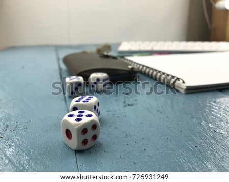 Selective focus to Dice on the wooden table. 