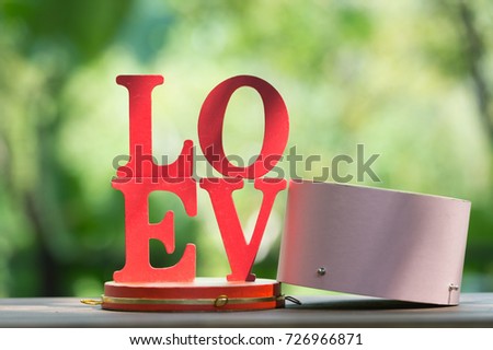 Wooden letters word "LOVE" with Wooden Letter L,O,V and E on wooden table, use for Valentine day background.