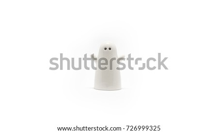 White cute ghost pepper shakers isolated on white background