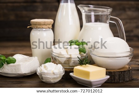 Fresh dairy products on the wooden table  Royalty-Free Stock Photo #727012012
