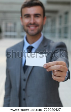 Professional showing his business card