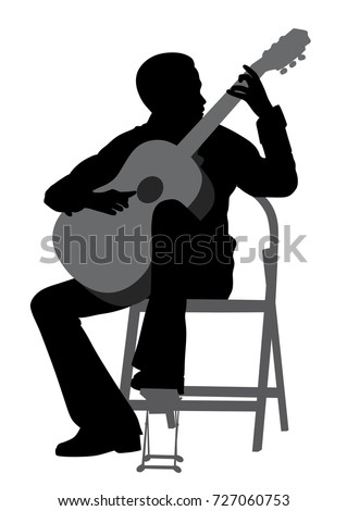 Young man playing acoustic guitar 