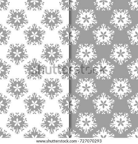 White and gray floral ornaments. Set of seamless backgrounds for textile and wallpapers