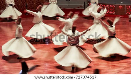 Semazen or Whirling Dervishes, Konya. Sufi whirling dervish (Semazen) dances at . Semazen conveys God's spiritual gift to those are witnessing the ritual. Royalty-Free Stock Photo #727074517