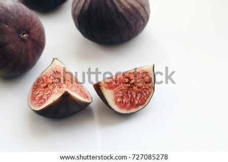 Fresh figs. Fruit with quarter slices on white background.