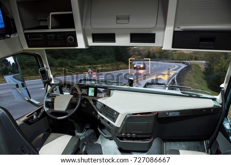 Self driving truck with head up display on a road. Inside view. Royalty-Free Stock Photo #727086667
