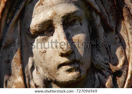 Virgin Mary statue. Vintage sculpture. (Religion, faith, suffering, love concept)