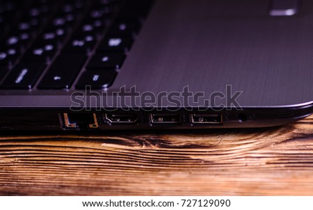 Modern laptop on the rustic wooden table