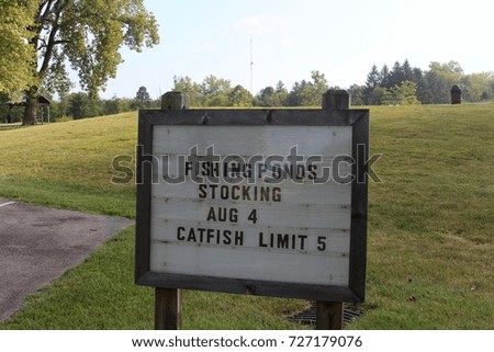 The catfish limit sign at the lake on a close up view.
