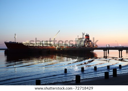 Gas and oil tanker, Lng, docked at the harbor at night Royalty-Free Stock Photo #72718429