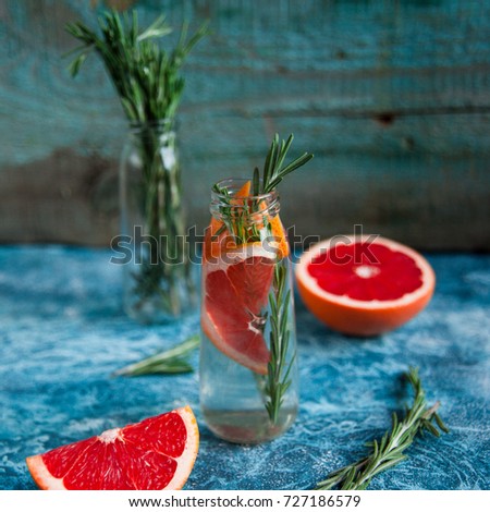 Infused water recipe. Grapefruit and rosemary detox water. Healthy lifestyle concept. Healthy habit of hydration.