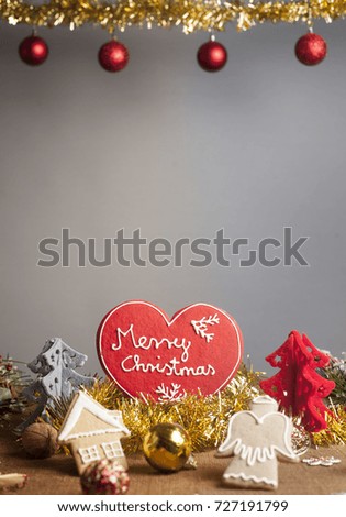 Christmas Background with various decorations. Christmas gingerbread with text icing.Plenty of space left for text.