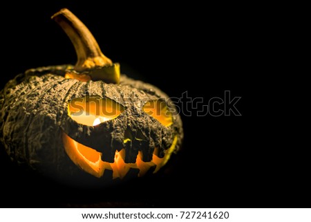 pumpkin halloween is evil face with isolated on black.