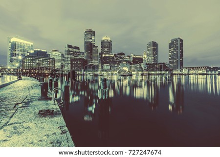 Boston Harbor and Financial District at sunset in Boston, Massachusetts.