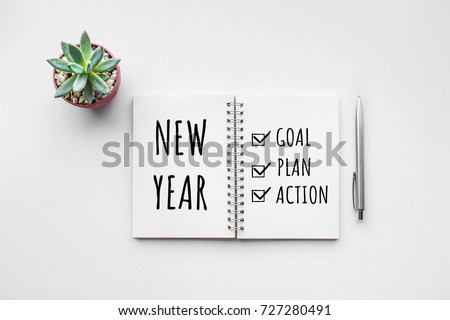 New year goal,plan,action text on notepad with office accessories.Business motivation,inspiration concepts Royalty-Free Stock Photo #727280491