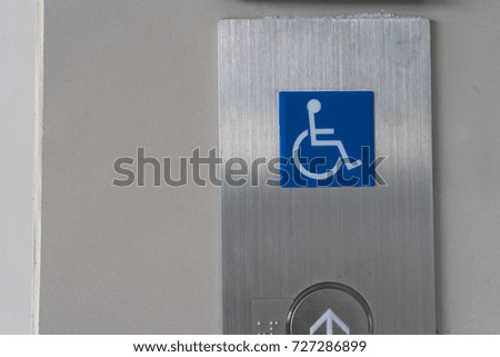 handicap sign front of elevator
