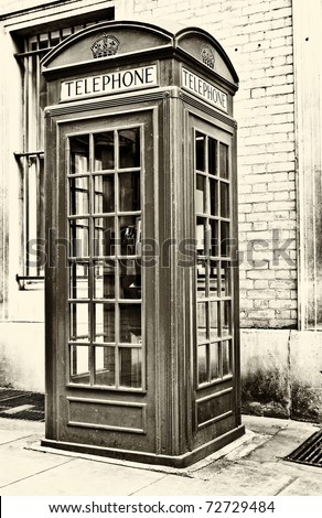 Vintage sepia image of an  iconic London phone booth