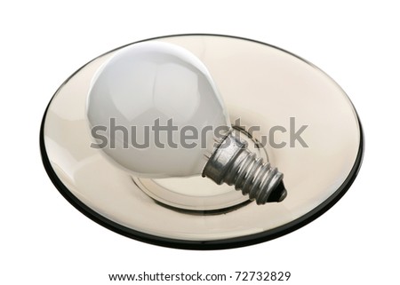 Lightbulb on a glass saucer are isolated on a white background