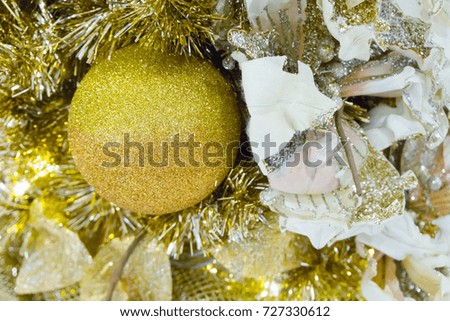 Happy new year and Christmas Concept. Golden ball and light decorate on the christmas tree.