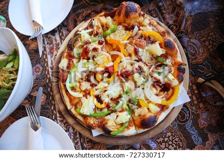 homemade pizza in the dish wood