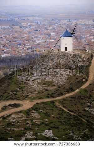 isolated windmill stand on hilltop in the open land of central Spain (Consuegra).