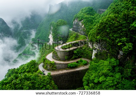 The winding road of Tianmen mountain national park (Zhangjiajie) in clouds mist, Hunan province, China Royalty-Free Stock Photo #727336858