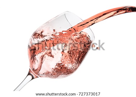 rose wine splashing on white background Royalty-Free Stock Photo #727373017