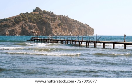 Empty pier on the background of the island