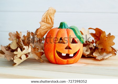 Picture of pumpkie over wooden background. Halloween concept.