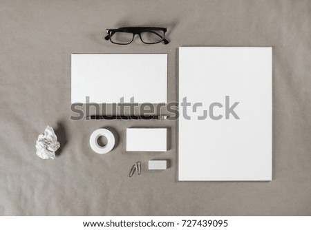Blank corporate stationery on craft paper background. Branding mock up for graphic designers portfolios. Top view.