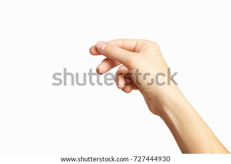 Empty female hand making gesture like holding something isolated at white background. Royalty-Free Stock Photo #727444930