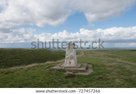 The Trig Point on the Summit of the Chalk Escarpment of White Horse Hill next to the Bronze Age Hill Fort of Uffington Castle Part of the Berkshire Downs in Rural Oxfordshire, England, UK