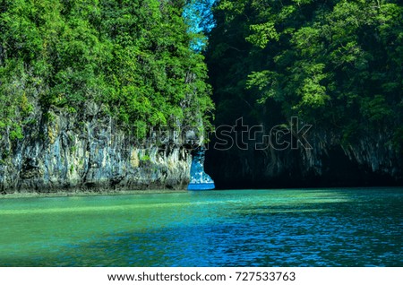  Seascape with island and bright blue sky on sunny day in summer background.