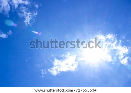 Sunlight shines through the clouds in the sky.