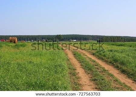 A dirt road in the field
