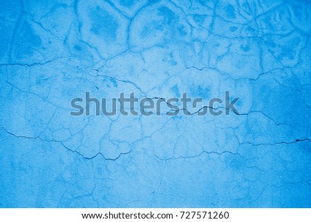 Textured blue cracked wall