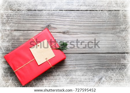 Christmas background - Christmas present red gifts box on vintage wooden background with snowflake. Creative Flat layout and top view composition with border and copy space design.