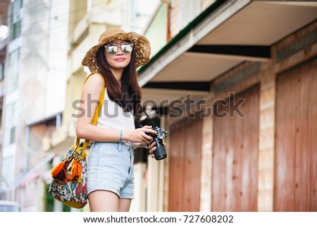 Asian photographer tour old city in Thailand