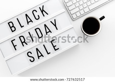 Black friday sale word on lightbox with computer keyboard on whtie table with space