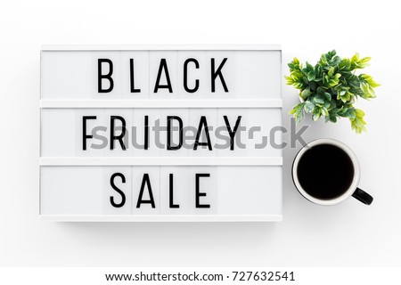 Black friday sale word on lightbox on white table