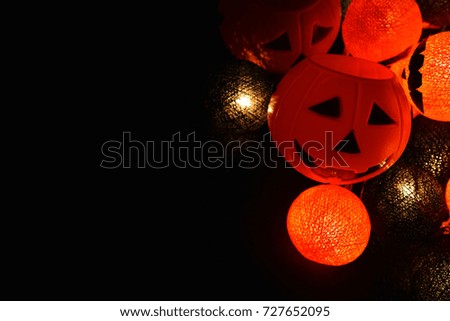 The concept of light on the night Halloween.Round lamp shape of pumpkin used to decorate with copy space for text.