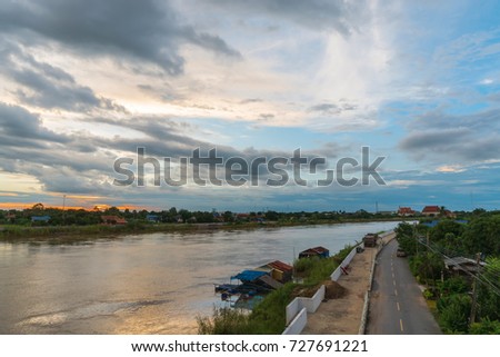 Landscape of big river during sunset twilight sky background, view from across bridge