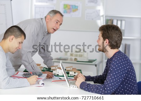 male architect students working